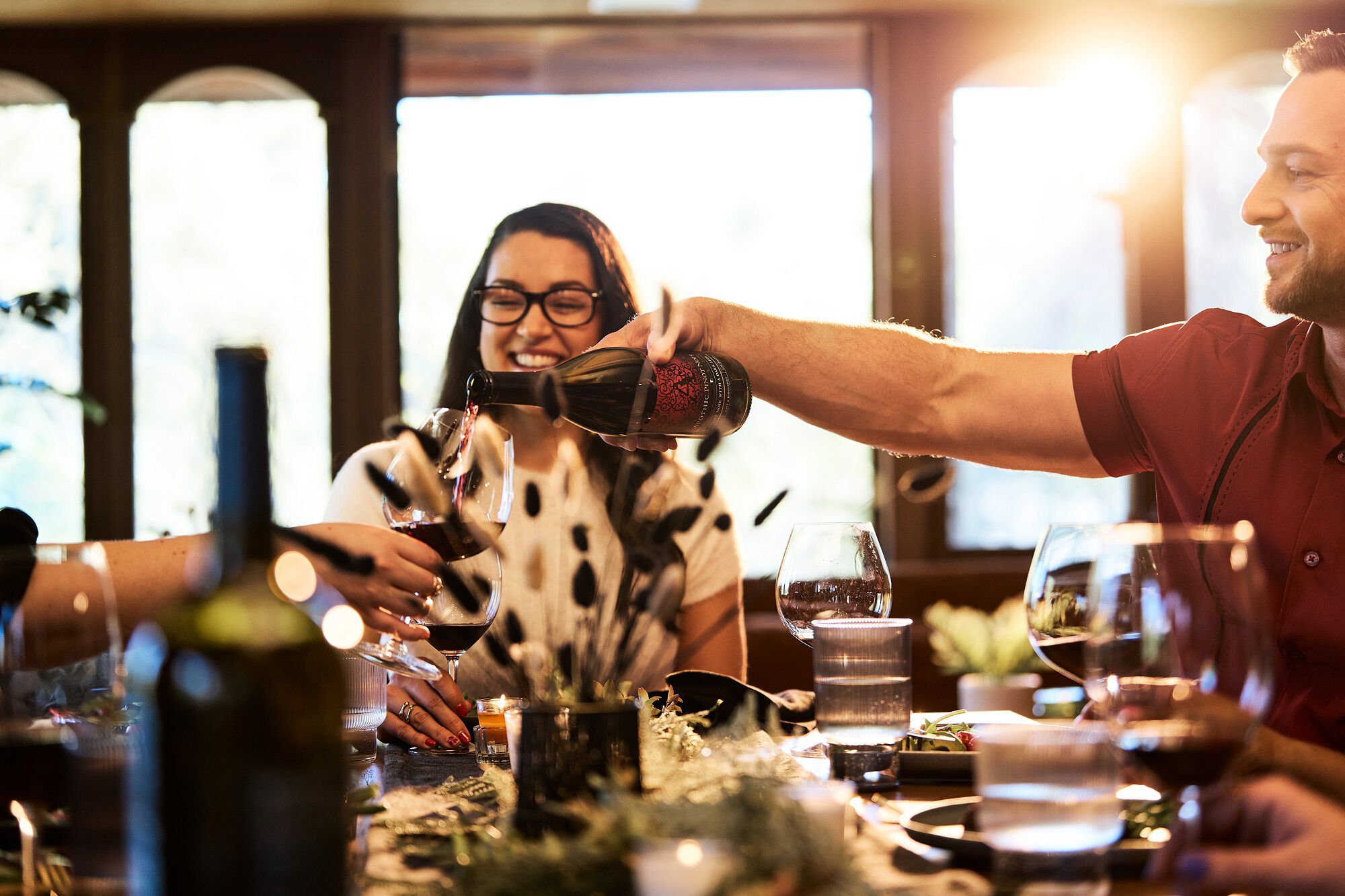 Friends enjoying Apothic wine and food.