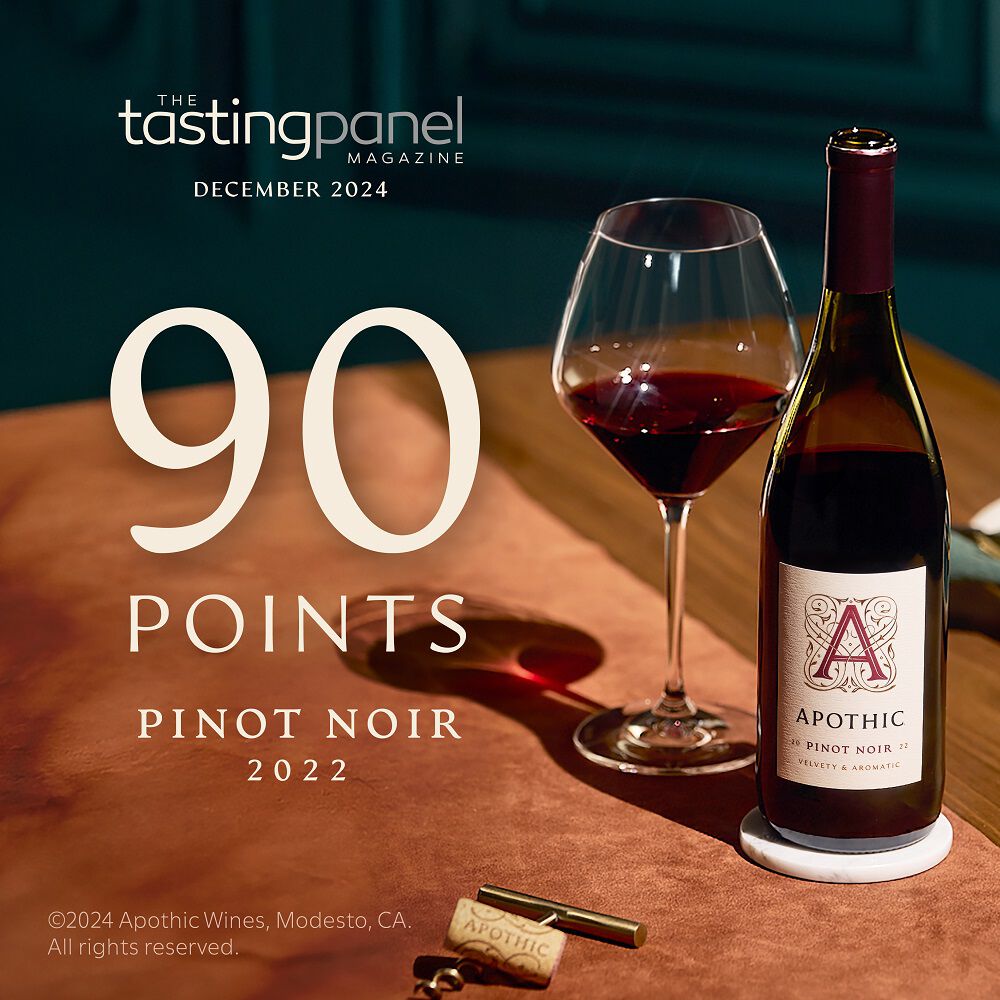 A 91-point rating badge from The Tasting Panel Magazine for the 2022 Apothic Pinot Noir. The quote reads: 'Wild strawberry, root beer, caramel, and toasty chocolate meld within an earthy frame.' Dated December 2024.